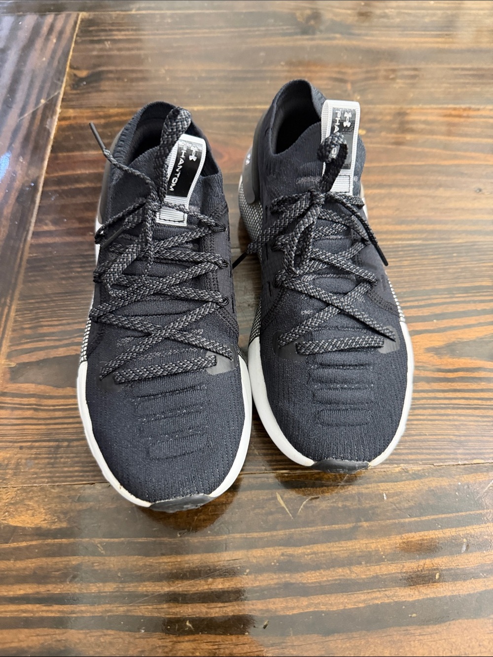 Under Armour women’s Black and White Knit Athletic Sneakers